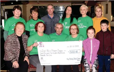  ?? Photo by Michelle Cooper Galvin. ?? Christy Lehane and volunteers from the ‘Kerry Friends of Motor Neurone’ pictured receiving a cheque of €7,211 – the proceeds of a recent coffee morning fundraiser and charity abseil challenge.