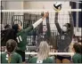  ?? JENNIFER FORBUS — FOR THE MORNING JOURNAL ?? Titan teammates Alexis Dunnigan (4) and Ja’Neja Nelson-Riley (8) coordinate a block against Panther Lesley Sanchez.