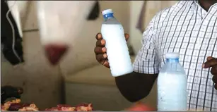  ??  ?? A meat vendor displays one of the dangerous chemicals used in the unorthodox preservati­on of meat