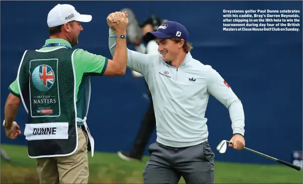  ??  ?? Greystones golfer Paul Dunne celebrates with his caddie, Bray’s Darren Reynolds, after chipping in on the 18th hole to win the tournament during day four of the British Masters at Close House Golf Club on Sunday.