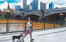  ?? AFP ?? People exercise in Melbourne. Australian and other media say this is the longest lockdown in the world.