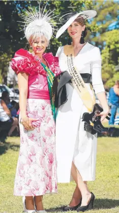  ??  ?? STUNNING: Fashions Lady of the Day runner-up Kymberlee Cockrem and winner June Sheppard at the Mareeba Races.