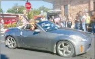  ?? Westside Eagle Observer/SUSAN HOLLAND ?? Madelyn Obert, Miss Gravette 2019, waves to the crowd as she rides down Main Street in the Gravette football homecoming parade. Madelyn was crowned Miss Gravette in the annual pageant held on Gravette Day, Aug. 10.