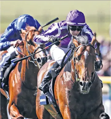  ??  ?? Turn of speed: Donnacha O’Brien rides his father Aidan’s Saxon Warrior to victory in the Qipco 2,000 Guineas at Newmarket