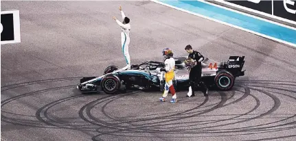  ?? KAMRAN JEBREILI/ASSOCIATED PRESS ?? Mercedes driver Lewis Hamilton of Britain celebrates after winning the Emirates Formula One Grand Prix at the Yas Marina racetrack in Abu Dhabi, United Arab Emirates on Sunday.