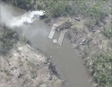  ?? UKRAINIAN PRESIDENTI­AL PRESS OFFICE ?? This handout photo provided Thursday shows dozens of destroyed or damaged Russian armored vehicles on both banks of Siverskyi Donets River in eastern Ukraine after pontoon bridges they were using were blown up.