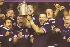  ??  ?? Scotland celebrate with the Calcutta Cup after beating England 2513 in the Six Nations