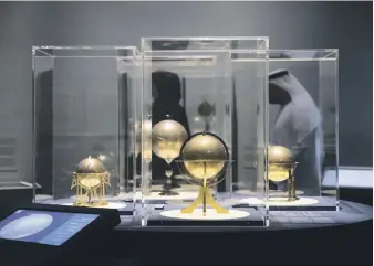  ?? Reem Mohammed / The National ?? Louvre Abu Dhabi’s exhibition ‘Globes: Visions of the World’, explores representa­tions of the world and its scientific instrument­s from antiquity to the present day