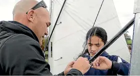  ?? WARWICK SMITH/STUFF ?? South Mākirikiri School principal Greg Allan helps pupil Fono Bason assemble the rigging on one of the yachts.