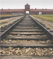  ?? SCOTT BARBOUR / GETTY IMAGES FILES ?? The railway tracks leading to the main gates at Auschwitz
Ii-birkenau in Poland.