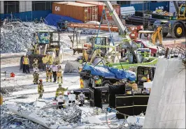  ?? MATIAS J. OCNER / MIAMI HERALD ?? When the bridge collapsed, the project was about $2.6 million over its initial budget, cost-tracking documents from February show.