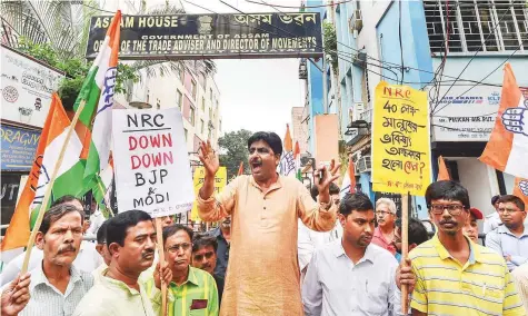  ?? PTI ?? Congress activists raise slogans during a protest against controvers­ial Assam’s National Register of Citizen draft in front of Assam House in Kolkata, West Bengal, yesterday.