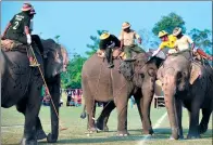  ?? PRAKASH MATHEMA / AFP ?? Elephant polo players from Tiger Tops Vikings and Tiger Tops Tuskers compete in last year’s event.