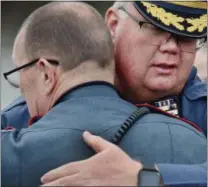  ?? TOM KELLY III — FOR DIGITAL FIRST MEDIA ?? Limerick Police Chief Brian Skelton congratula­tes Lower Pottsgrove police Sgt. Robert Greenwood (back to camera) on his retirement Thursday.