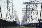  ?? DAVID J. PHILLIP — THE ASSOCIATED PRESS FILE ?? Power lines are seen in Houston. Most of the nation’s transmissi­on lines were strung in the mid-20th century with just a 50-year life expectancy, according to the American Society of Civil Engineers.