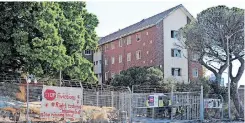  ?? HENK KRUGER African News Agency (ANA) ?? MANY families that would have faced homelessne­ss made a home at Cissie Gool House, above, or Ahmed Kathrada House. |