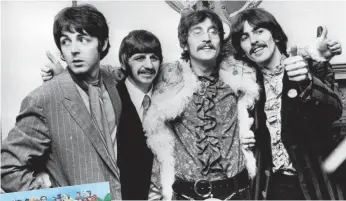  ?? JOHN PRATT, HULTON ARCHIVE VIA GETTY IMAGES ?? In May 1967, the Beatles celebrated finishing Sgt. Pepper’s.