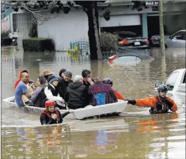  ?? MARCIO JOSE SANCHEZ/ THE ASSOCIATED PRESS ?? Rescue crews take out residents from a flooded neighborho­od Tuesday in San Jose, Calif. At least 225 residents of San Jose required assistance getting to dry land during the storm.