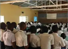  ?? HUANG WANQING / XINHUA ?? Students in a school in Rwanda’s capital Kigali watch the opening ceremony of Beijing 2022 Olympics on Feb 5 local time. The nation’s telecommun­ication facilities have improved thanks to Chinese support to hundreds of villages.