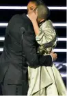  ??  ?? AND I LOVE HER: Drake kisses Rihanna after presenting her with the Video Vanguard award