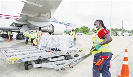  ??  ?? The vaccines being offloaded yesterday. (DPI photo)