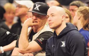  ?? Mitchell Layton / Getty Images ?? Bill Murray, left, and son Luke Murray, Xavier assistant coach, watch a Big East Tournament quarterfin­al between Seton Hall and Creighton at Madison Square Garden in 2016. UConn hired Luke Murray on Monday as an assistant coach.