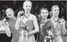  ?? Tony Avelar / Associated Press ?? Bradie Tennell, foreground, after winning the women’s free skate with Mirai Nagasu, left, Karen Chen, second from right, and Ashley Wagner at the U.S. Figure Skating Championsh­ips.