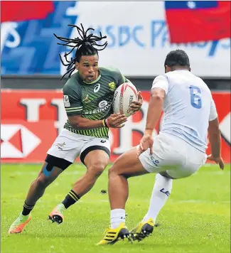  ?? Picture: GETTY IMAGES ?? POWER RUN: Joe Perez of South Africa faces his Samoan opponent during their quarterfin­al at the World Rugby Sevens Series at Stade Jean Bouin in Paris yesterday. The Blitzboks went on to win the final 15-5 against Scotland