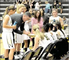  ?? MARK HUMPHREY ENTERPRISE-LEADER ?? Prairie Grove coach Kevin Froud outlines assignment­s during a break in the action. Froud got the Lady Tigers competing for seeding position in the district tournament. Following a 55-46 defeat at Gentry on Jan. 19, he applauded the Lady Tigers as they...