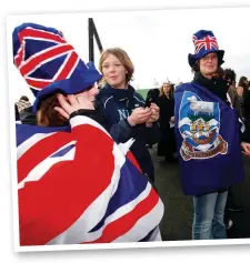  ?? ?? Red, white and blue Stanley residents commemorat­e the 25th anniversar­y of the Argentine surrender, 2007. Six years later, 99.8 per cent of islanders voted to remain a British Overseas Territory