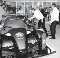  ?? IAN ALLEN ?? Kyle Gregg, with hand on vehicle, shows off his race car to (from left), Minister of Tourism Edmund Bartlett; Minister of Energy, Science and Technology Fayval Williams; president of the Jamaica Gasolene Retailers Associatio­n, Gregory Chung and CEO of GB Energy-Texaco Jamaica, Mauricio Pulido, at the Texaco Jamaica , Centenary Anniversar­y press launch, held at Jamaica Pegasus Hotel in New Kingston on February 19.