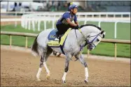  ?? Andy Lyons / Getty Images ?? White Abarrio during morning training Thursday for the Kentucky Derby at Churchill Downs.