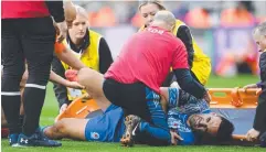  ?? Picture: Getty ?? Tyrone May is helped onto a stretcher.