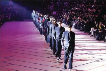  ?? FRANCOIS GUILLOT/AFP ?? Models present creations by Dior, during the men’s Fashion Week for the Fall/Winter 2017/2018 collection in Paris on Friday.