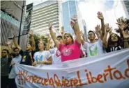 ?? THE ASSOCIATED PRESS ?? Students hold an anti-government protest earlier this month to mark the third anniversar­y since the killing of student protester Bassil da Costa by security forces during weeks of unrest in Caracas, Venezuela. Bassil’s sister, Yenicer da Costa, no...
