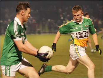  ??  ?? Páidí Cullen of Cloughbawn on the ball as Craig Casey (Duffry Rovers) tries to work out his next move in Friday’s Joyces Expert Intermedia­te ‘A’ championsh­ip final in St. Patrick’s Park.