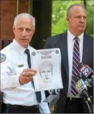  ?? PETE BANNAN — DIGITAL FIRST MEDIA ?? West Goshen Police Chief Joseph Gleason and Charles A. Gaza, chief of staff from the Chester County District Attorney’s office, hold up a sketch of the suspect in the murder of Bianca Nikol Roberson, who was shot and killed as she drove home on the...