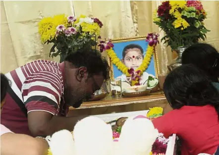  ??  ?? Painful goodbye: Muniandy watching over Vasantha Piriya at their house in Nibong Tebal.