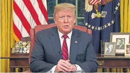  ?? [AP PHOTOS] ?? In this image from video, President Donald Trump speaks during a televised address from the Oval Office of the White House Tuesday in Washington.