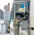  ?? ?? Paperwork is checked at the tri-border between Ukraine, Belarus and Russia