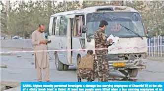  ??  ?? KABUL: Afghan security personnel investigat­e a damage bus carrying employees of Khurshid TV, at the site of a sticky bomb blast in Kabul. At least two people were killed when a bus carrying employees of an Afghan television station was bombed in Kabul yesterday. — AFP