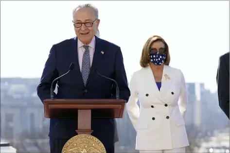  ?? ALEX BRANDON — THE ASSOCIATED PRESS ?? Senate Majority Leader Chuck Schumer of N.Y., speaks as House Speaker Nancy Pelosi of Calif., holds an enrollment ceremony for the $1.9trillion COVID-19relief bill, on Capitol Hill, Wednesday, March 10, 2021, in Washington.