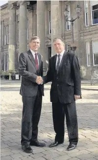  ??  ?? ●● Ainsley Arnold, right, is greeted by Macclesfie­ld Conservati­ve MP David Rutley