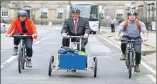  ??  ?? Fergus Ewing tries a new e-cargo bike with Claire Daly of Sustrans and Stuart Henderson from Transport Scotland.