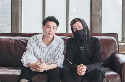  ?? PHOTOS PROVIDED TO CHINA DAILY ?? Zhang Yixing with Norwegian record producer and DJ Alan Walker. Zhang made his US debut alongside Walker in August while giving a performanc­e at the Lollapaloo­za music festival in Chicago.