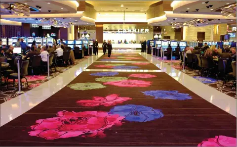  ?? AP PHOTO BY ERIC RISBERG ?? People gamble inside Graton Resort and Casino in Rohnert Park, Calif., Oct. 29, 2013. The campaign that could bring legalized sports betting to California has become the most expensive ballot initiative fight in state history. Two rival proposals are pitting wealthy Native American tribes against Fanduel, Draftkings and other online gambling companies, in a contest over what could become the nation’s most lucrative marketplac­e.