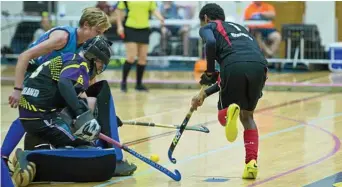  ?? of ?? BLOCKED: Toowoomba Funnel Webs 1 keeper Matthew West blocks a shot from Kosia Williams Rockhampto­n Turtles in their grand final clash at USQ’s Clive Berghofer Recreation Centre on Sunday.