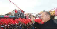  ?? (Kayhan Ozer/Presidenti­al Palace/Reuters) ?? TURKISH PRESIDENT Recep Tayyip Erdogan greets supporters on Friday during the opening ceremonies for a new metro line in Istanbul.