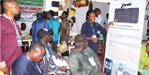  ??  ?? Dr. Nnenna Nwosu-Nworuh presents her research works to the Federal Ministry of Science and Technology team of assessors led by Professor Peter Onwualu at the stand of Federal University Ndufu-Alike Ikwo (FUNAI), Ebonyi State, during the 2018 National Technology and Innovation Expo in Abuja