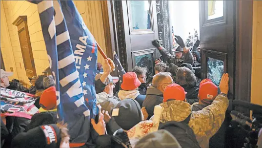  ?? WIN MCNAMEE/GETTY ?? Protesters supporting President Donald Trump break into the U.S. Capitol on Wednesday. Congress was holding a session to ratify President-elect Joe Biden’s Electoral College win.